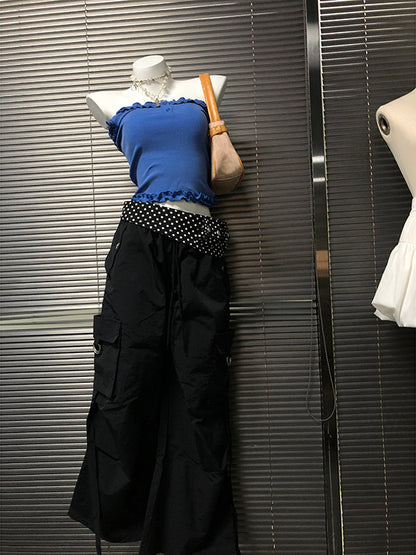 Black wide-leg pants with white polka-dot waistband band