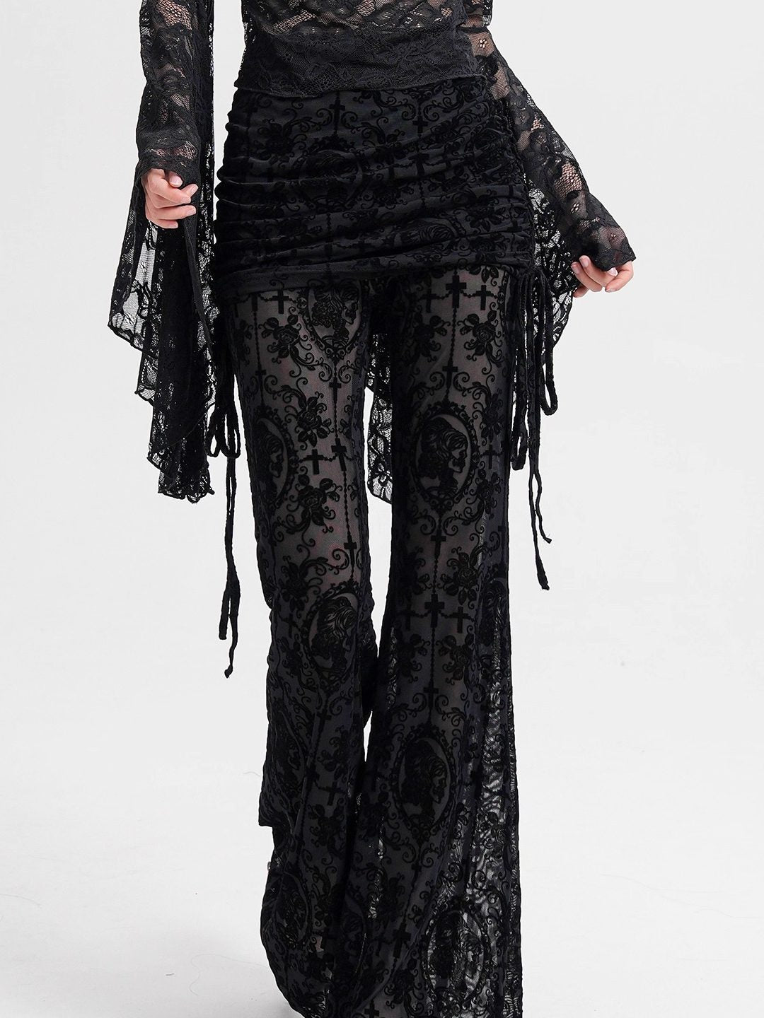 Black mesh flocked culottes with ornate print panels and side fringe ties