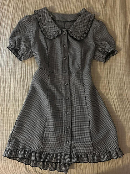Plaid midi dress with doll collar, button front, short puff sleeves, and ruffled hem