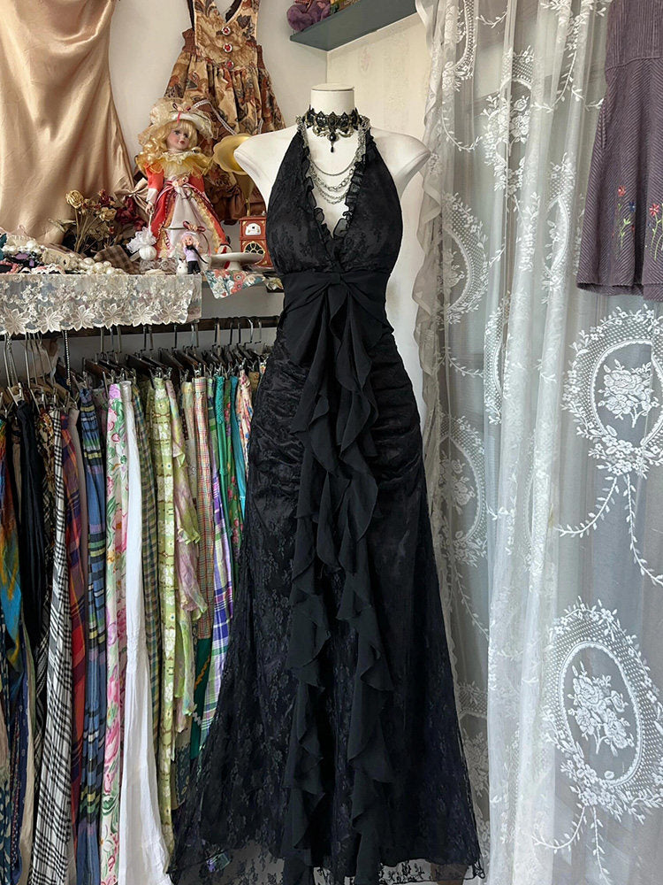 Black halterneck vintage dress with corset look, draped waist bow and tiered ruffle hem