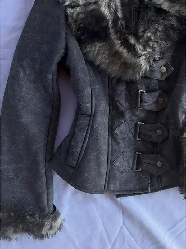 Gray motorcycle jacket detail: fur collar edge, flap pockets, and snap-buckle placket