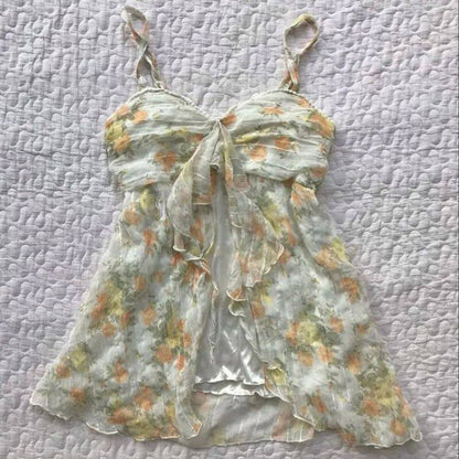 White sheer floral cami dress with bow tie at neckline and spaghetti straps