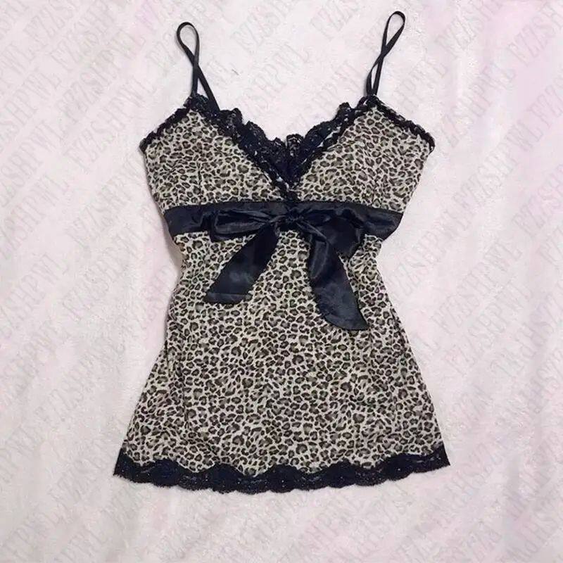 Leopard print satin slip dress with spaghetti straps, black bow at bust, lace trim