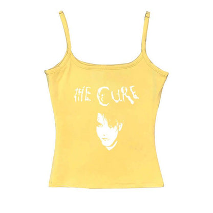 Yellow sleeveless graphic cami with centered The Cure logo and face print