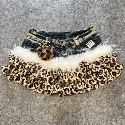 Leopard print denim skirt with white faux fur trim and heart pendant on denim waistband