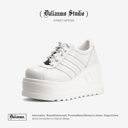 White platform lace-up sneaker with three stripe panels and thick tread sole