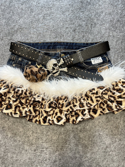 Leopard print denim skirt with white faux fur trim and black studded belt, heart pendant