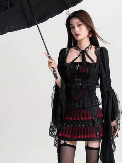 Black lace halterneck vest blouse with red panel and layered red ruffles at the hem.