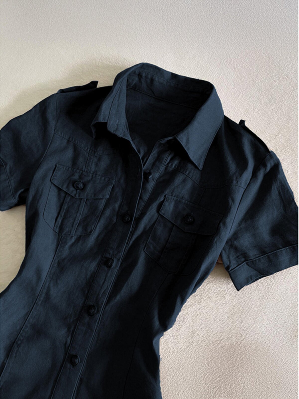 Dark blue short-sleeve shirt dress with pointed collar and button placket