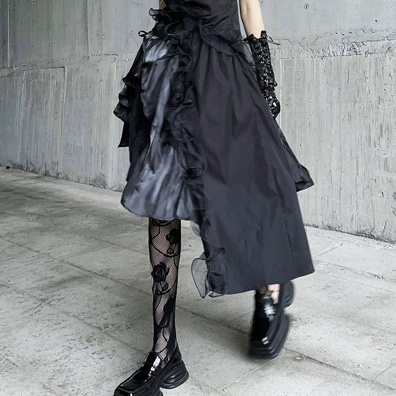Black fishnet stockings with rose-style floral motif and lattice netting