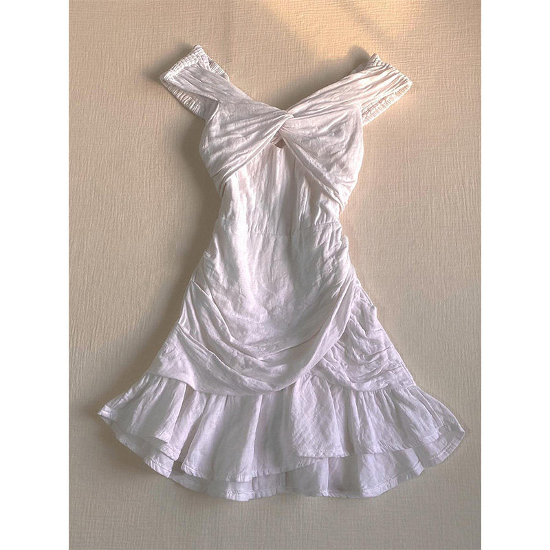 White one-shoulder short dress with large bow at neckline and flared tiered skirt