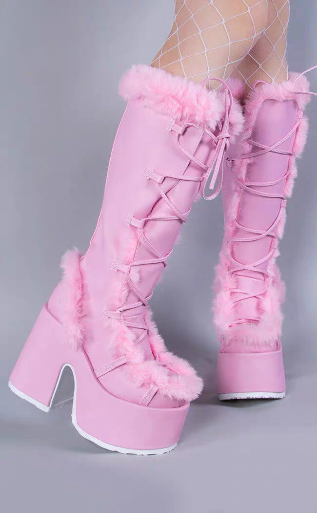 Pink platform ankle boots with lace-up front, faux-fur trim, and tall chunky heel