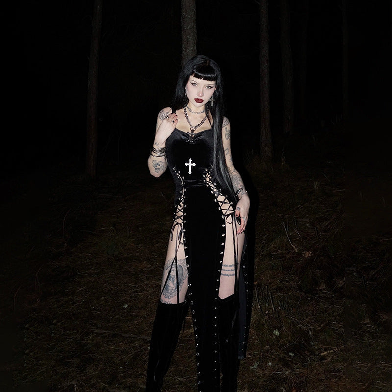 Black sleeveless cut-out dress with V-neck, cross detail, front studs, long fringe skirt