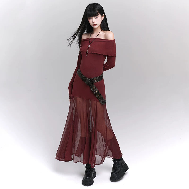Leather belt with rosette buckle and studded strap over long skirt