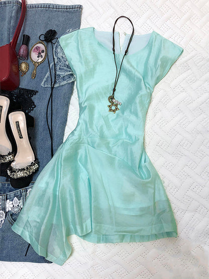 Mint green irregular hem sleeveless mini dress with gathered, flared skirt