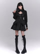 Black slip dress with corset-style lace bodice and layered ruffle skirt, long puff sleeves