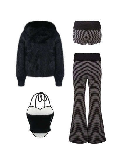 Black faux fur jacket, striped shorts, striped flared trousers, and black/white mini bag