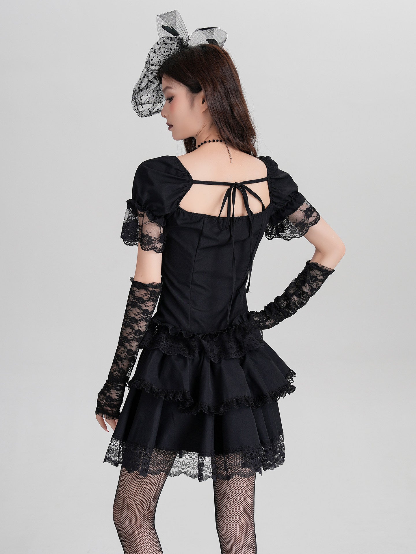 Black gothic mini dress, open back with lace corset tie and ruffled sleeves