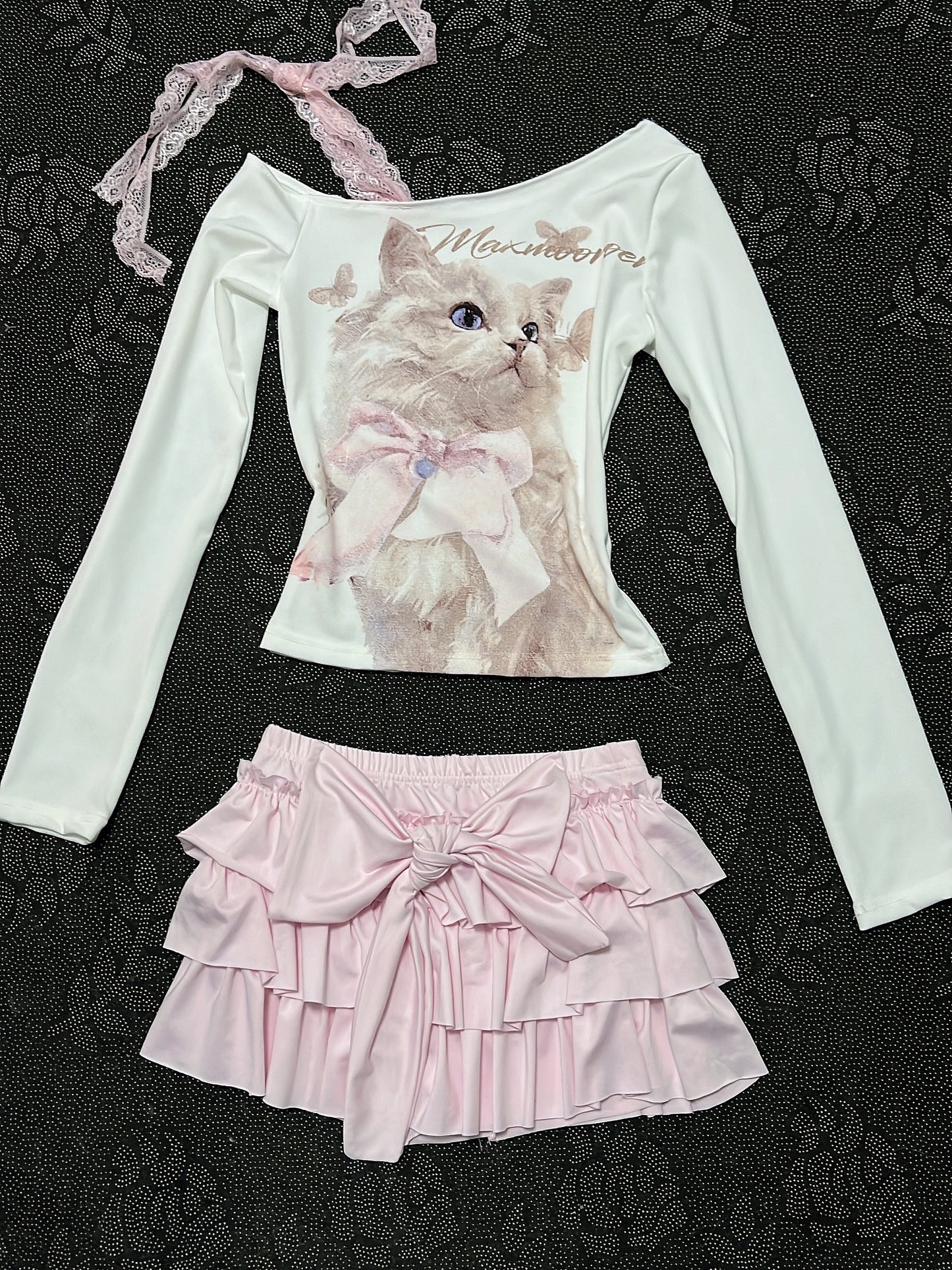 Cream long-sleeve cat top with lace strap; pale pink tiered ruffle skirt with bow