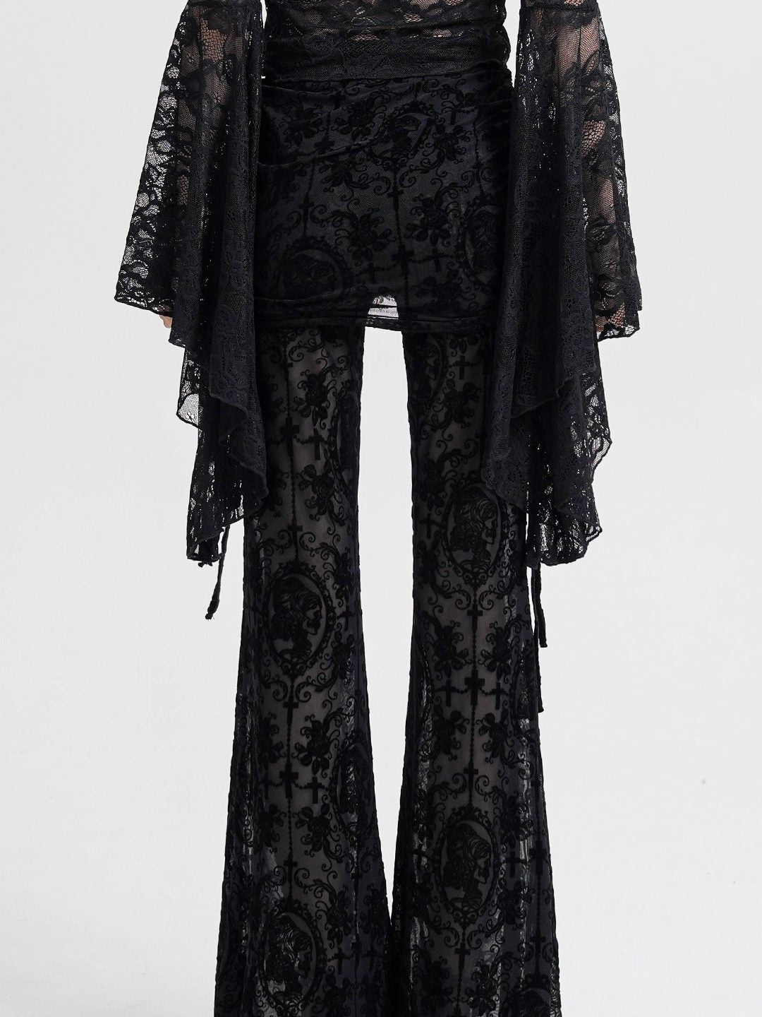 Black mesh flocked culottes with draped wide legs and ornate lace panels