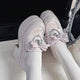 White lace platform loafers with ribbon bow and heart charm detail