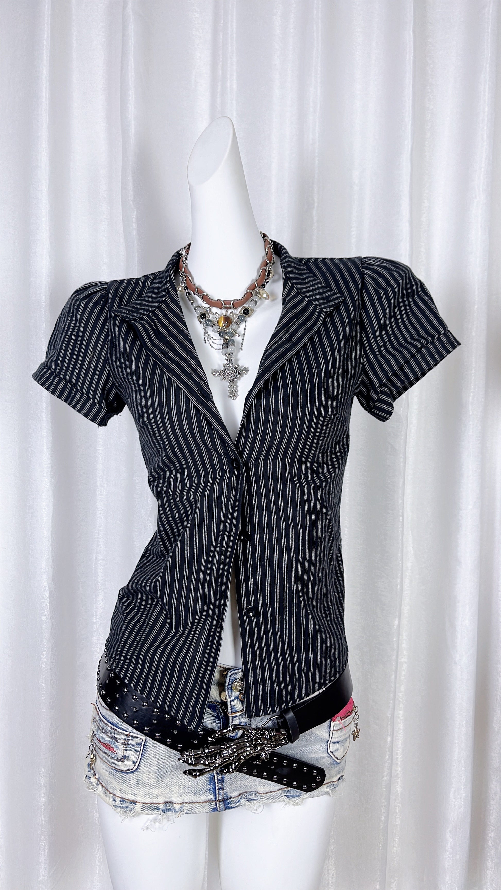 Navy pinstriped short-sleeve lapel shirt with front buttons and V-neck