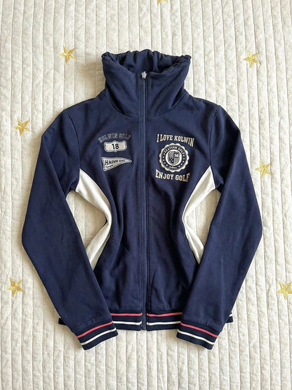 Navy stand-collar zip jacket with embroidered golf graphics and white angled side panels