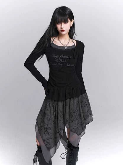 Black long-sleeve top with ruffled waist and dark tiered skirt, draped side panels