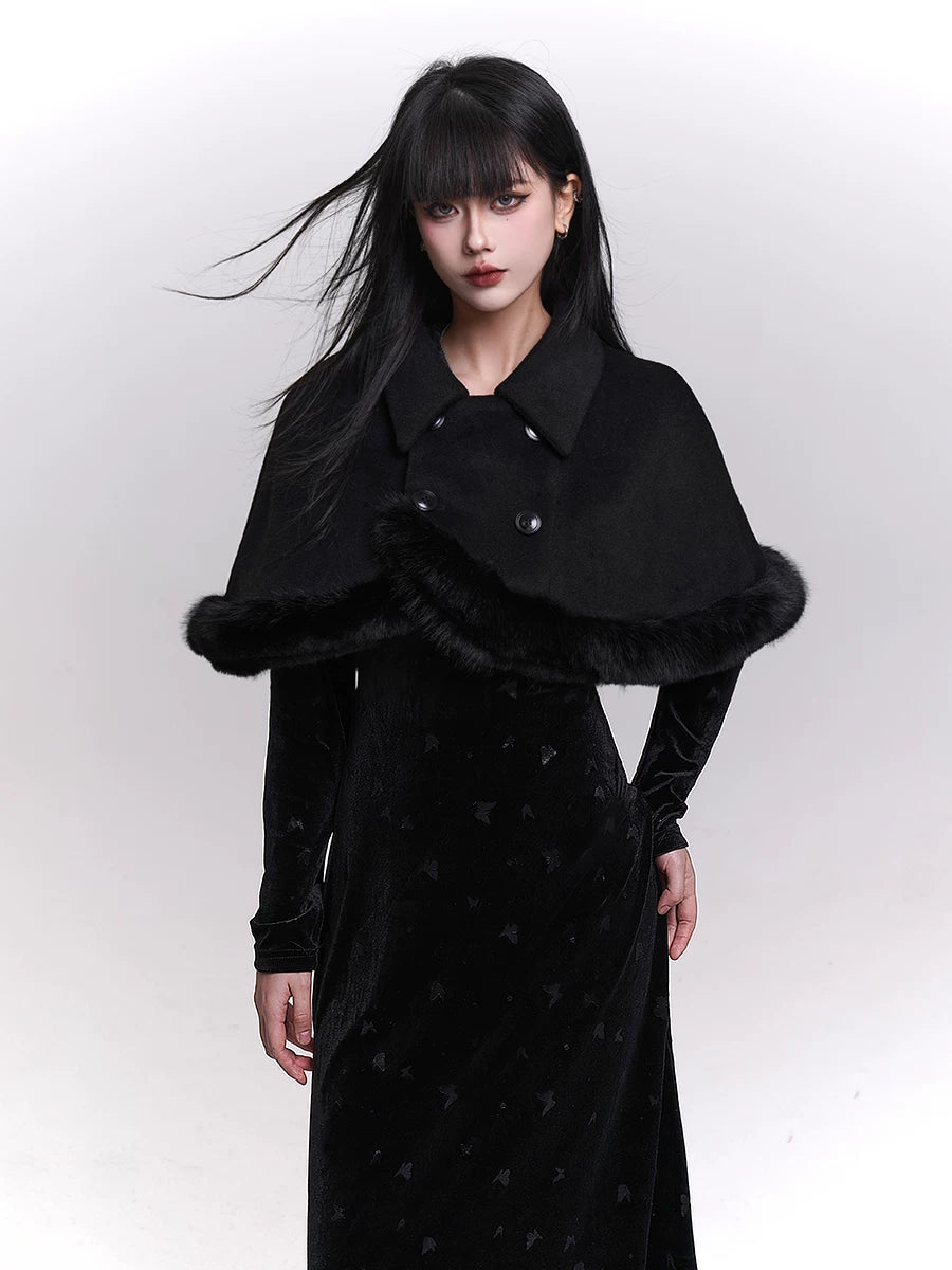 Woolen cape shawl jacket with dark fabric, buttoned neckline, and wide faux fur border