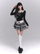 Black long-sleeve cropped top with plaid bow-tie neckline and layered check skirt