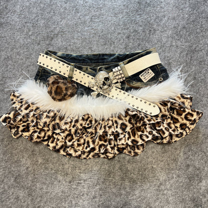 Leopard print denim skirt with white faux fur trim and beige studded belt with heart pendant