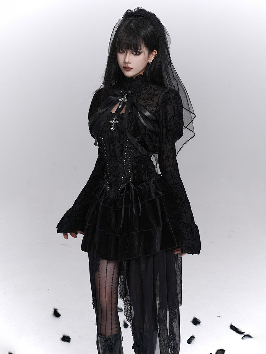 Black strapless corset top with decorative bows, jeweled center, and lace detailing