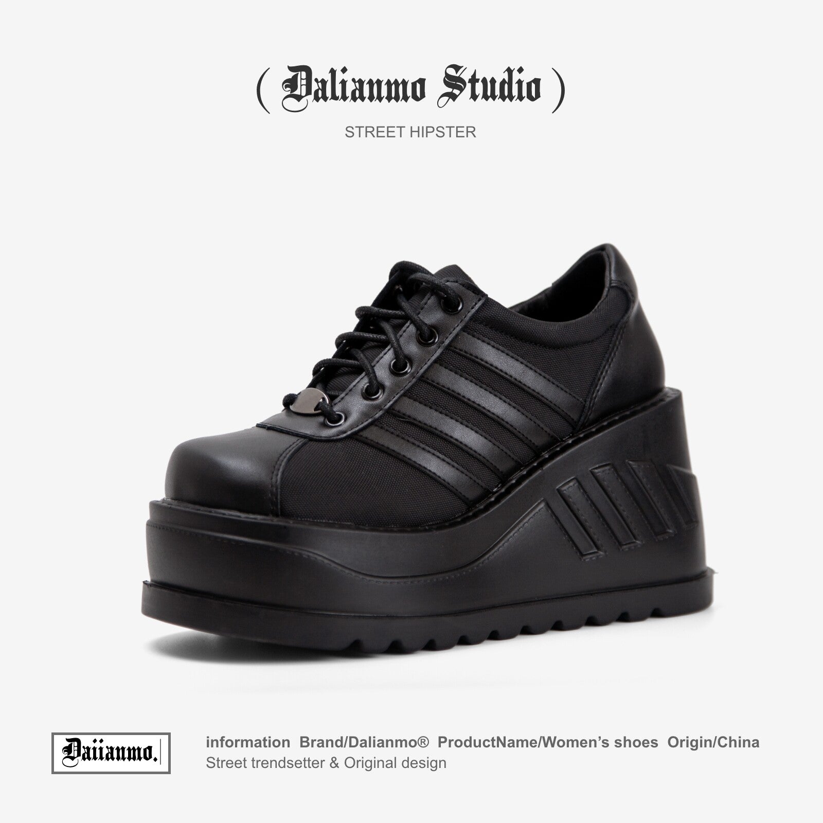 Black platform lace-up sneaker with three stripe panels and chunky tread sole