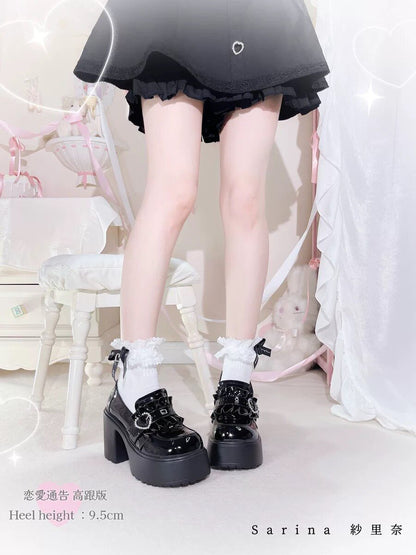 Black chunky platform Mary Janes with bow straps and block heel