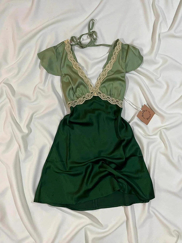 Green lace V-neck mini dress with puff sleeves, corset-style seams, flared skirt.