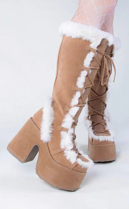 Tan platform ankle boots with lace-up front and white faux-fur trim at top