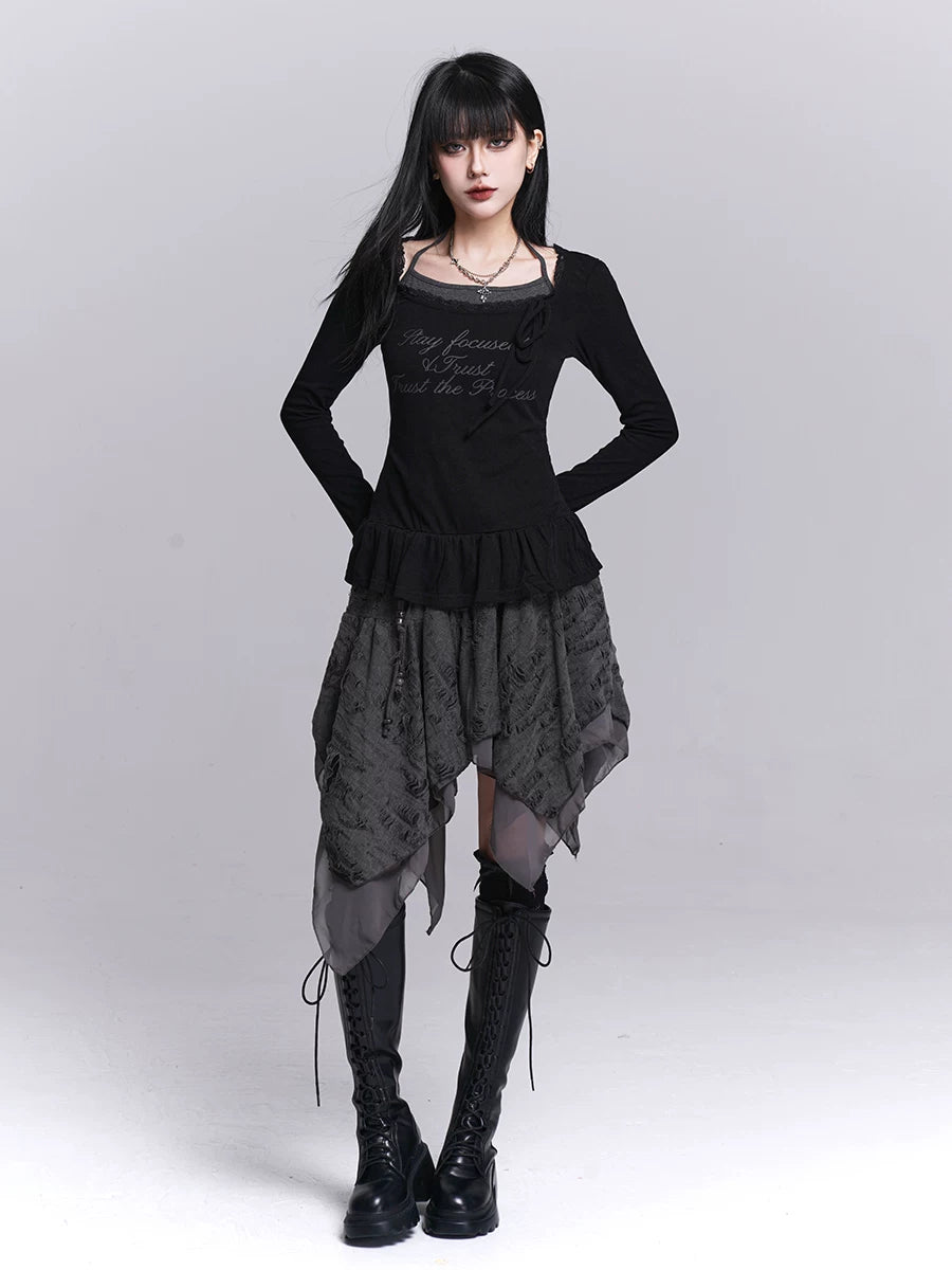 Black long-sleeve dress with fitted bodice, ruffled waist, patterned asymmetrical skirt