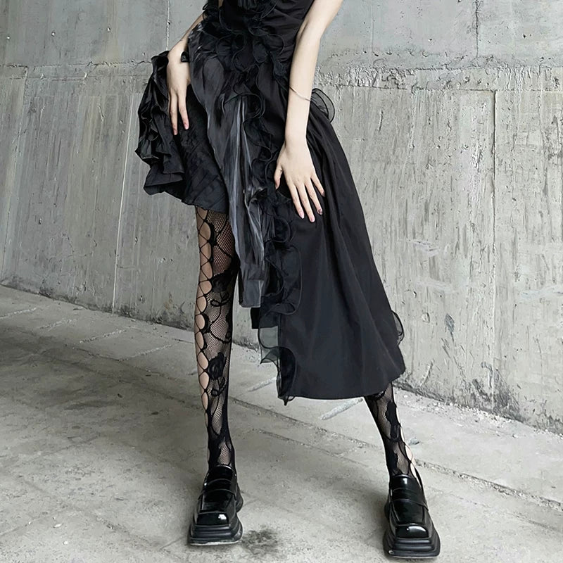 Black fishnet stockings with floral rose-style lace panels