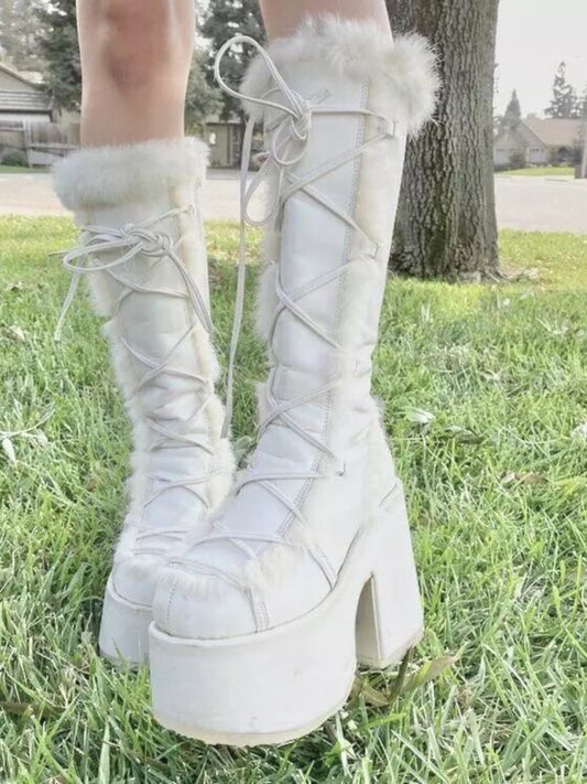 White platform ankle boots with lace-up front and fluffy faux-fur trim