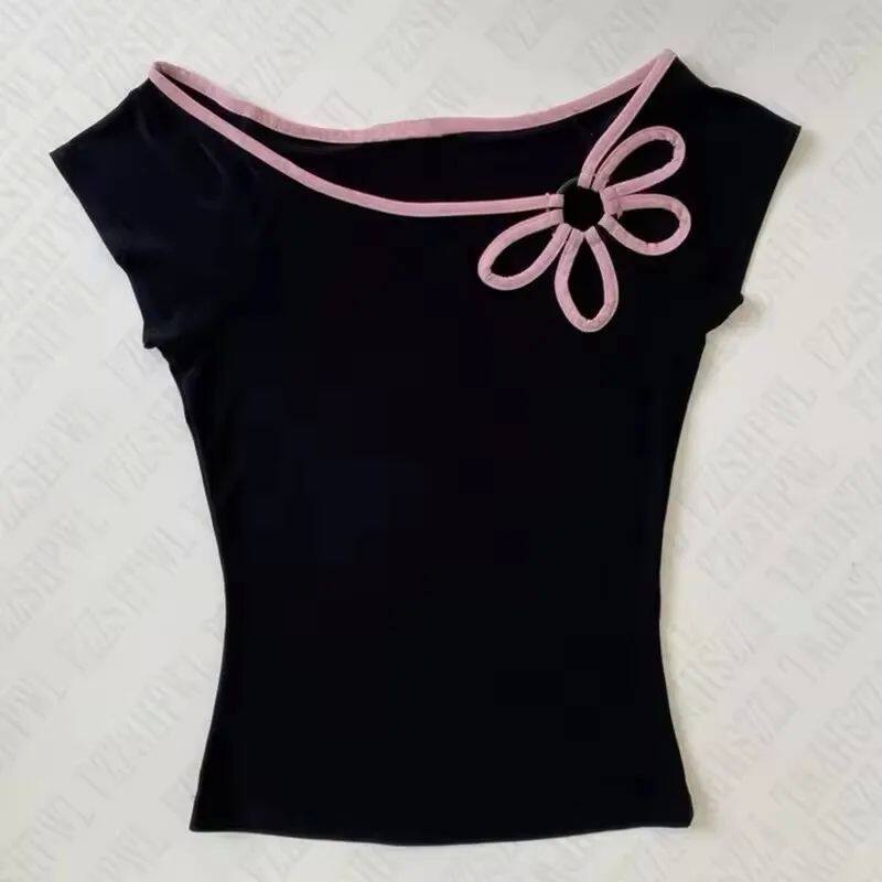 Black off-shoulder top with light pink trim and bow at neckline