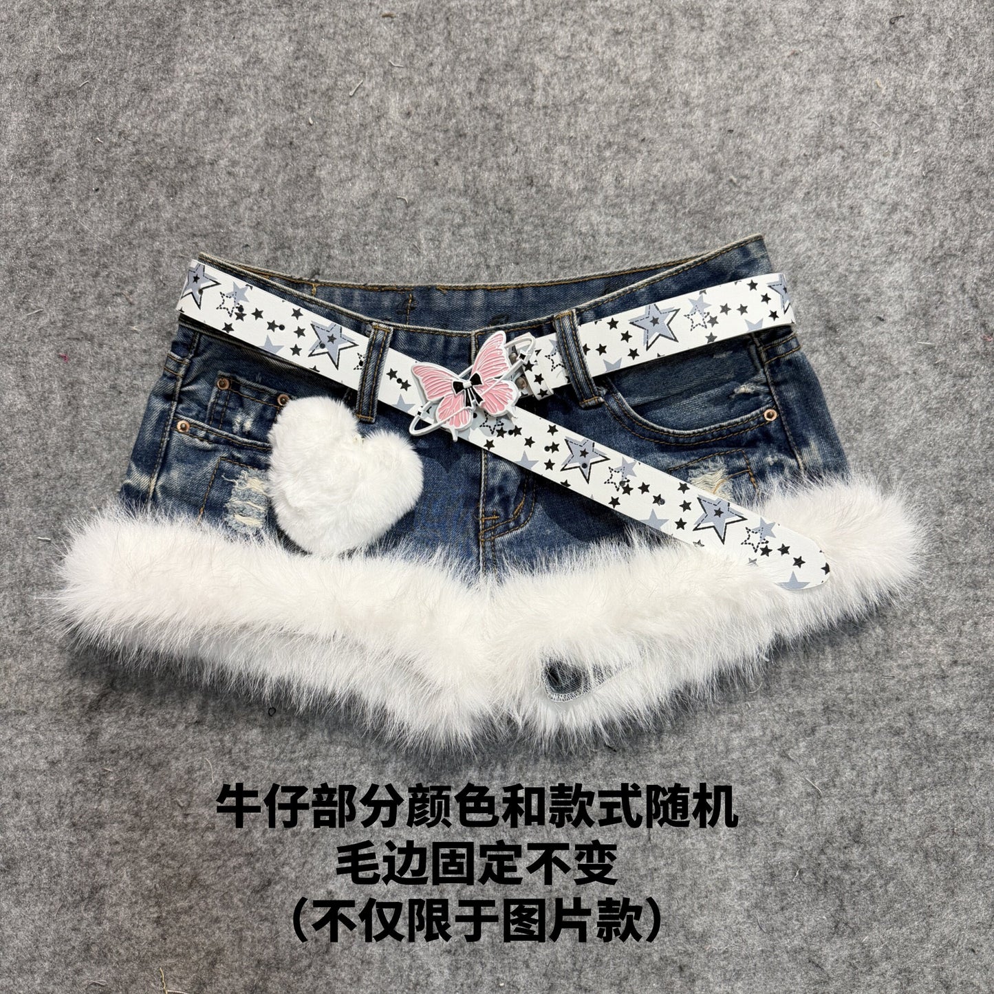 Dark blue denim shorts with white faux-fur trim and star-print belt