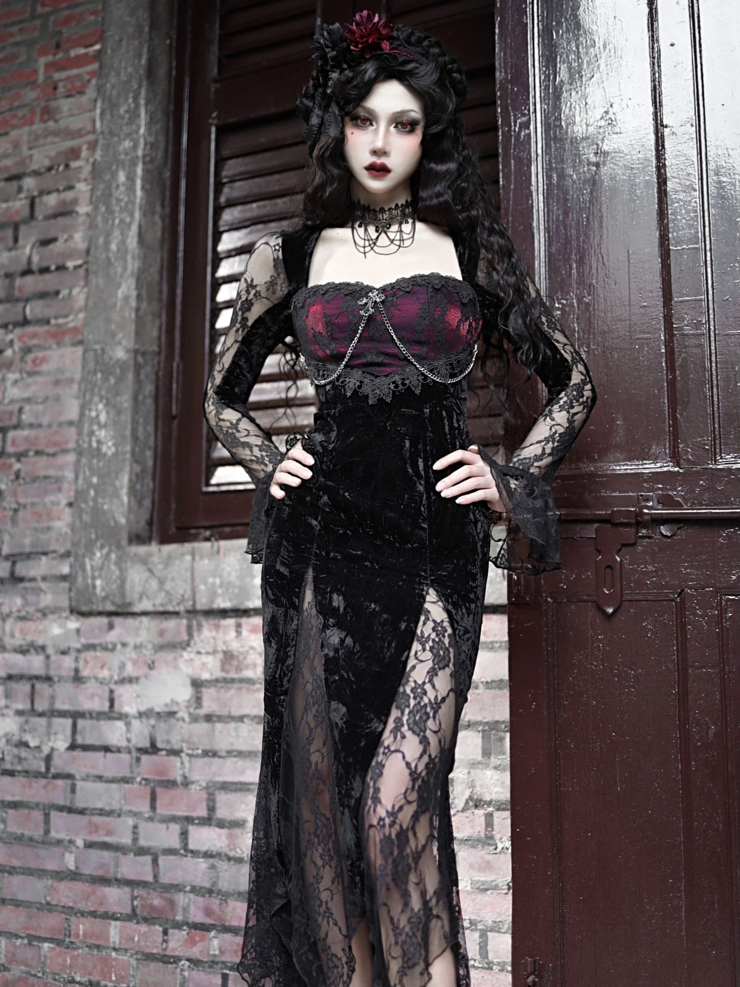 Black lace fishtail gown with burgundy corset front, long sleeves, side lace panels