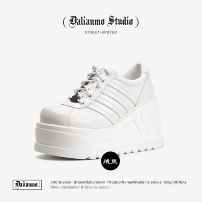 White platform lace-up sneaker with three stripes and thick platform sole