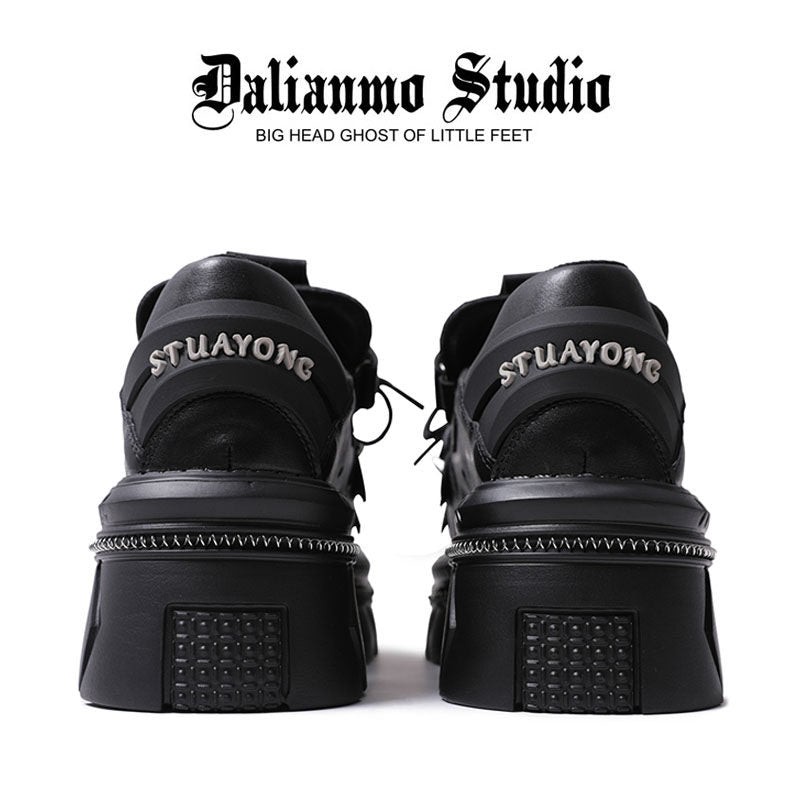 Black platform flats back view with lace-up, heel tab, and chunky platform sole